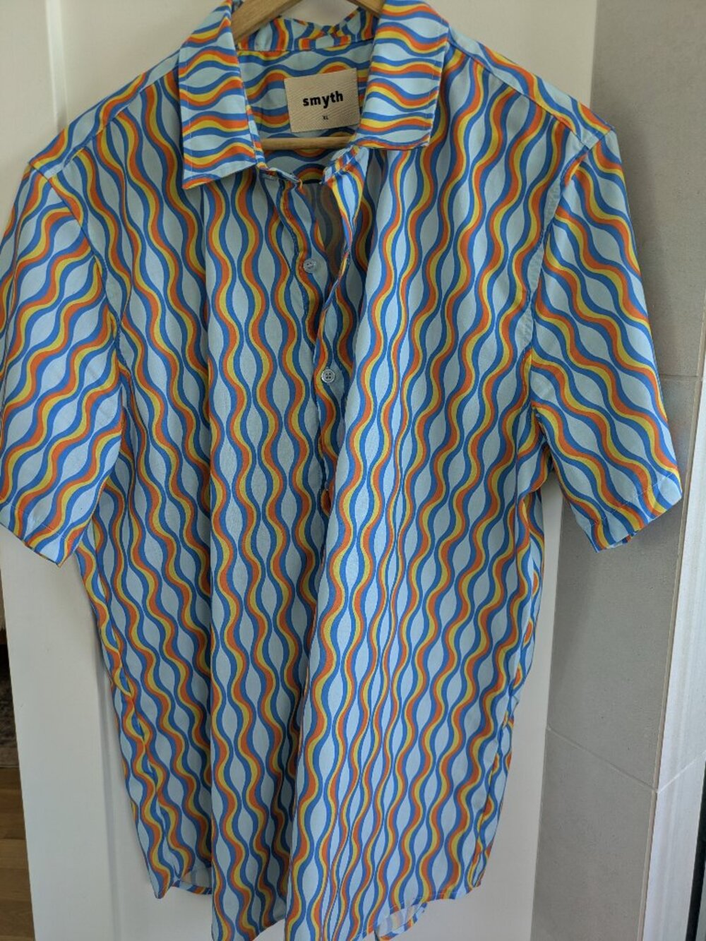 Smyth XL size men's retro-style button down shirt featuring a wavy blue, orange,